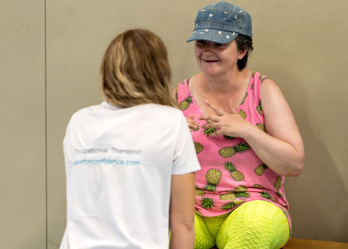 Participant talking with an occupational therapist during a Sport for Confidence session