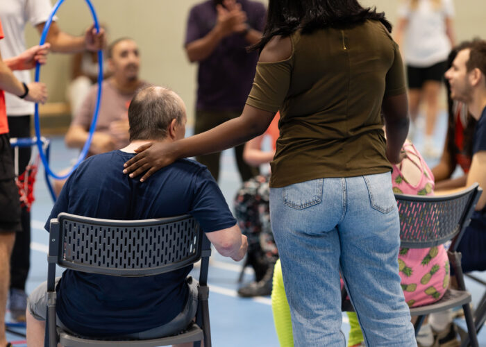 Group of people taking part in a group activity in a leisure centre setting