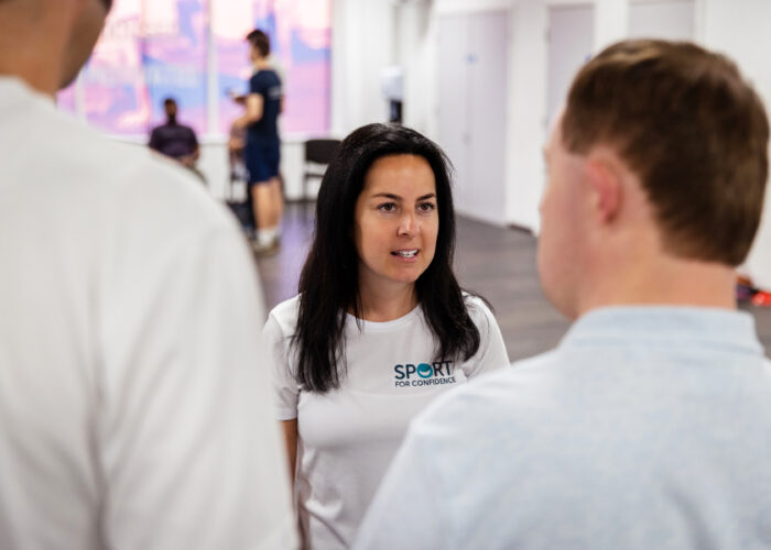 Our-Expertise-1 A woman talking to two men