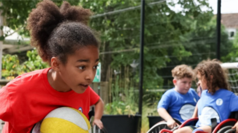Children taking part in a wheelchair basketball activity
