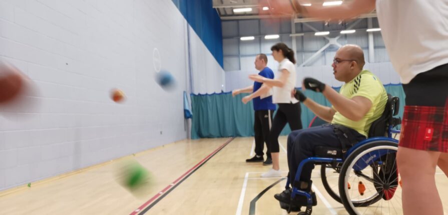 Participants taking part in an inclusive indoor sports activity