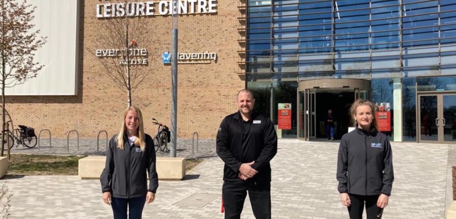 Sport for Confidence staff standing outside a leisure centre