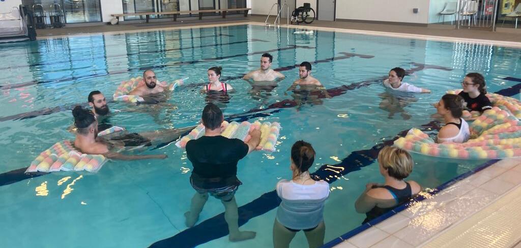 Group taking part in an inclusive hydrotherapy and wellbeing session