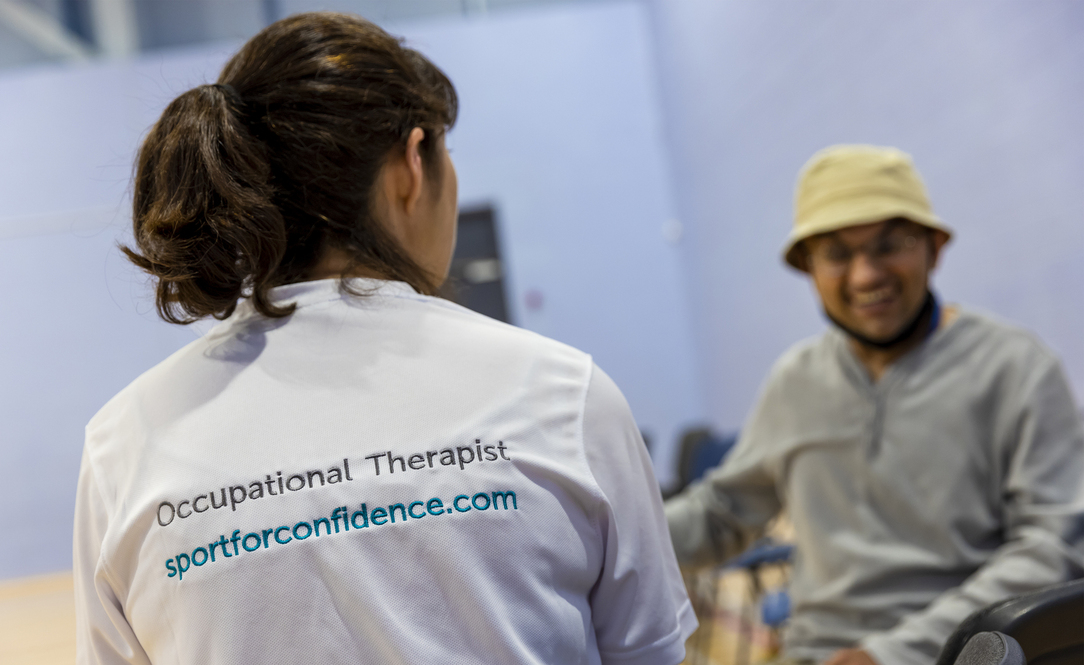 Occupational therapist supporting participant during inclusive wellbeing session