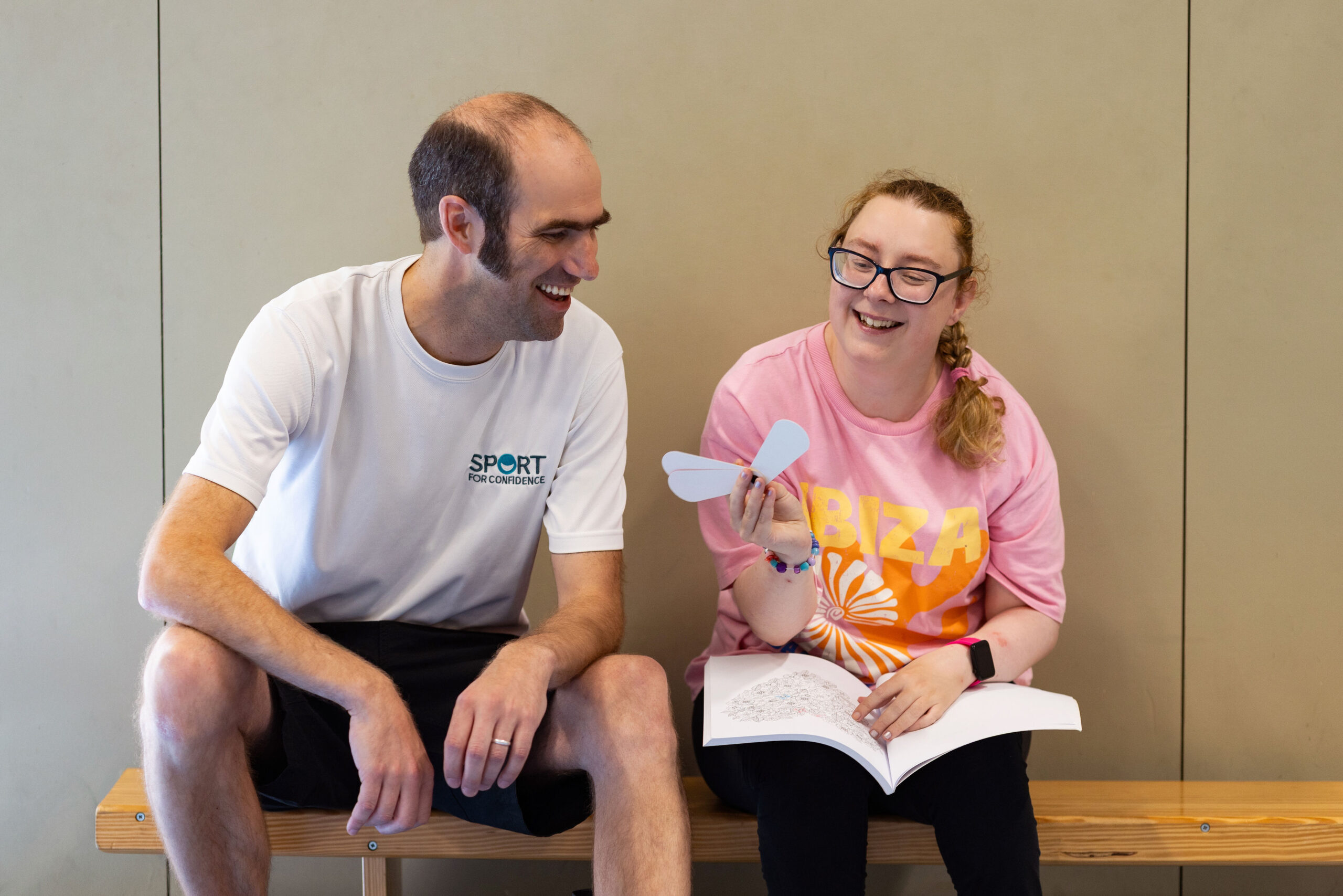 Coach and participant taking part in an inclusive activity session