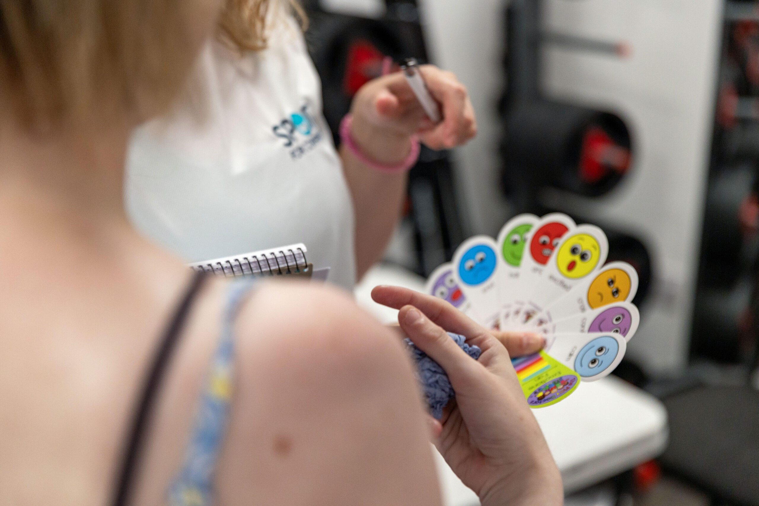 Person using emotion communication cards during a support session
